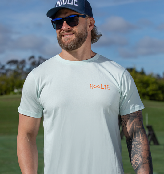 80's Vintage X Bones Men's Golf T Shirt in Iceberg with orange Hoolie front logo and retro skull-and-drivers back design.